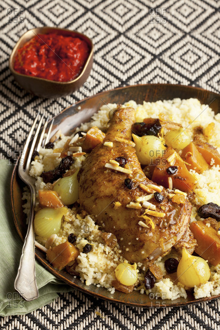 Plate of Moroccan chicken and couscous with raisins
