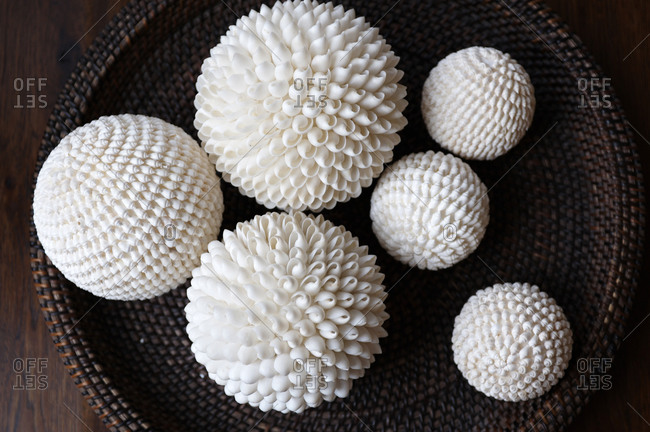 Basket of spheres made of white shells