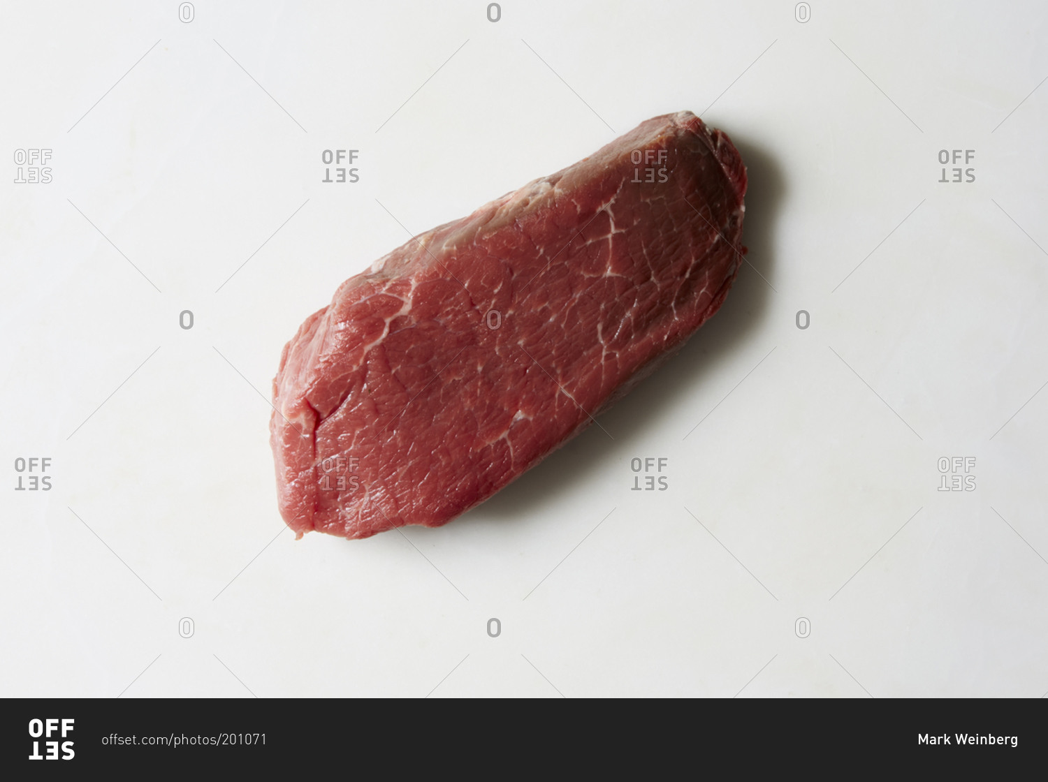 Raw cut of beef on white background
