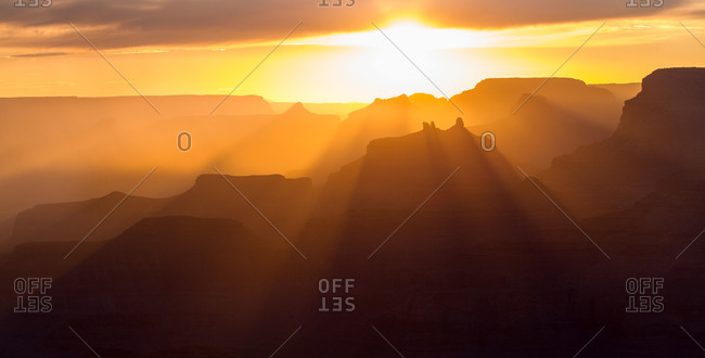 Rays of sunlight pass through the many temples and buttes of the Grand Canyon including Angel's Gate