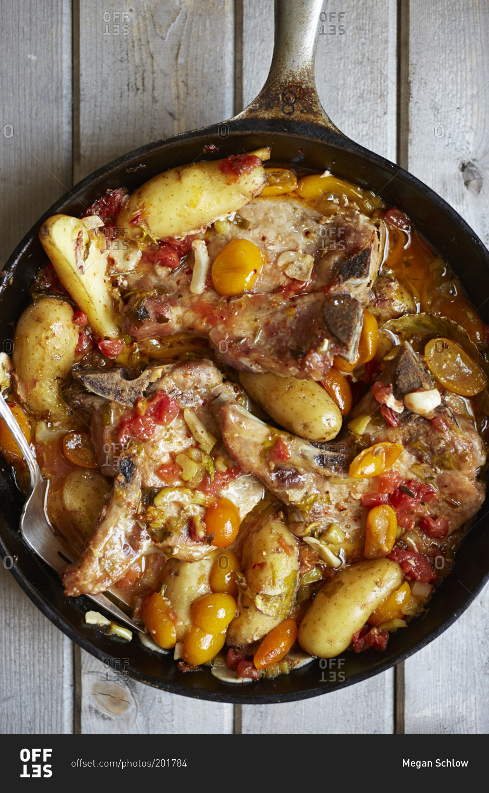 Meat and potato stew in cast iron pan