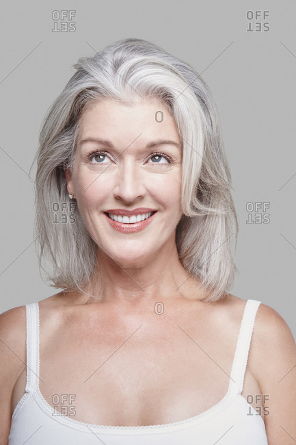 Studio portrait of a woman with grey hair