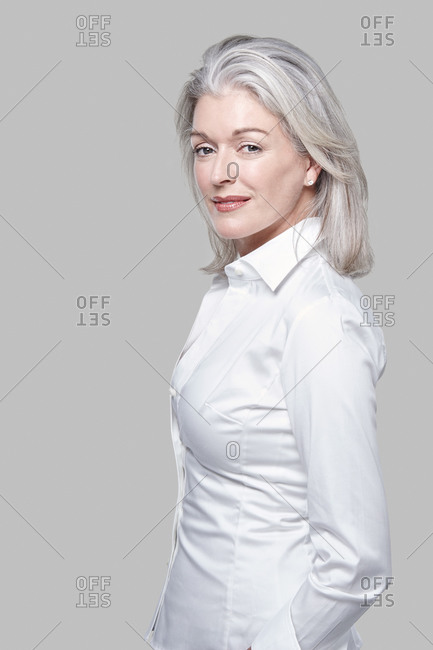 Studio portrait of a woman with grey hair