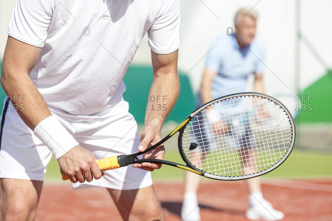 Tennis player holding tennis racket