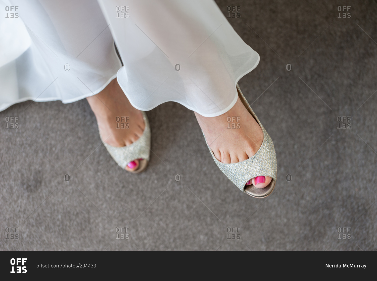 Close-up of bride's silver open-toe shoes