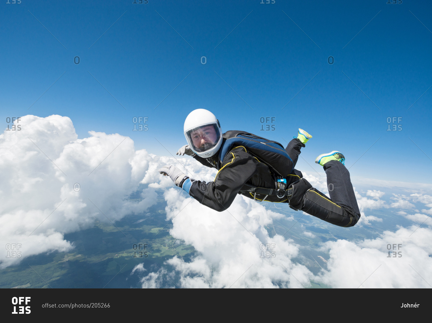 Sky-diver freefalling in air