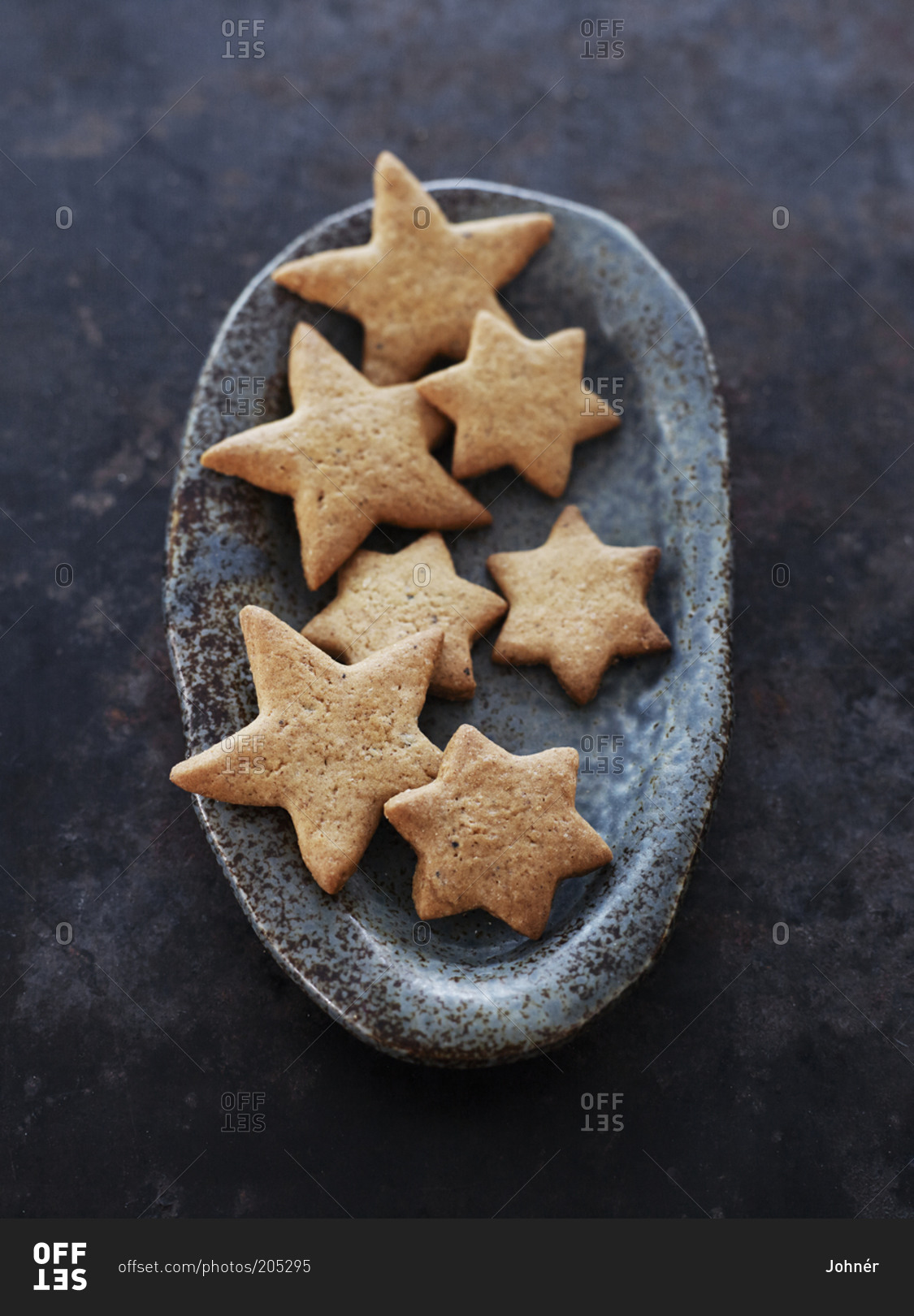 Star-shaped cookies in terracotta dish