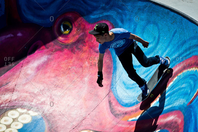 Brussels, Belgium - June 2, 2013: Teen riding skateboard in skate park