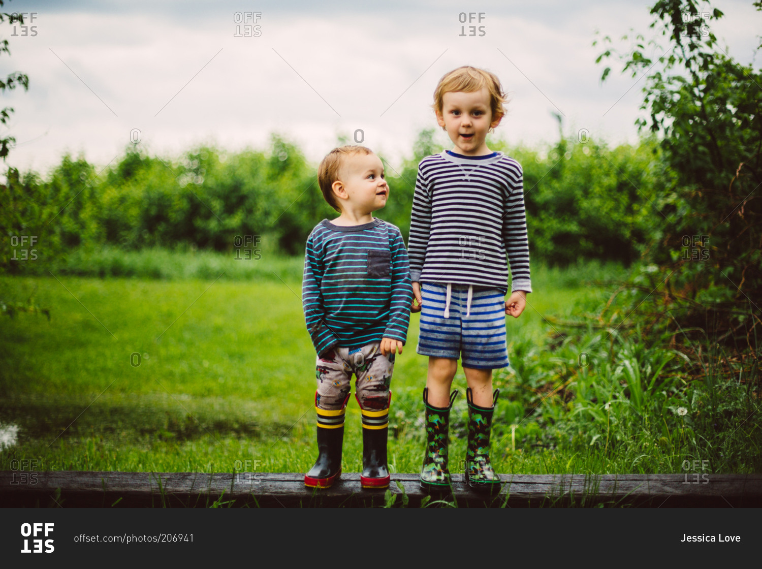 Portrait of young boys in boots stock photo OFFSET