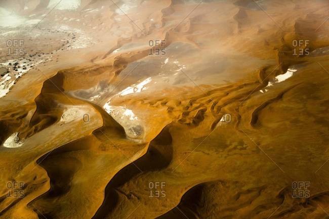 Textured sand dunes from the air in Namibia
