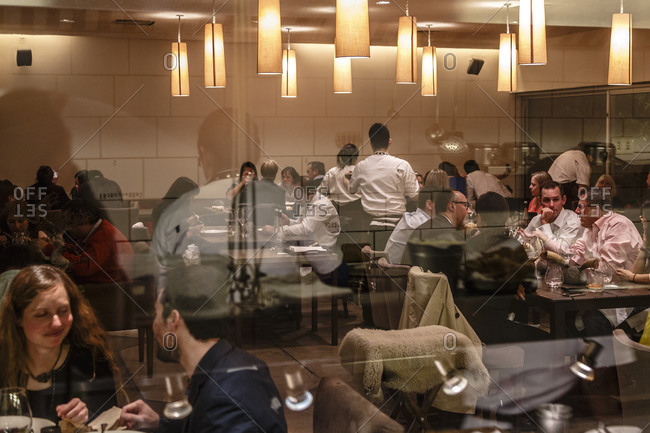 Santiago, Chile - September 26, 2014: Diners and waiters in upscale restaurant, Santiago, Chile