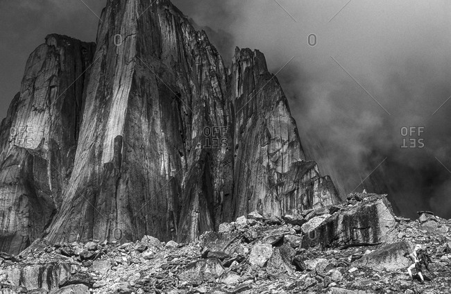 Climber hiking equipment into Lotus Flower Tower