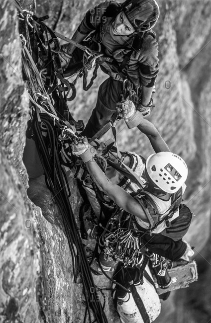 Team of women rock  climbers on a big wall