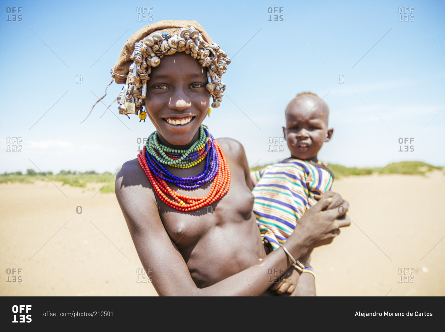 Omo Valley, Ethiopia - August 6, 2014: Young Ethiopian mother holding