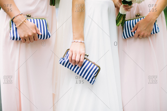 hand holding red luxury clutch bag isolated on black background. 6274927  Stock Photo at Vecteezy
