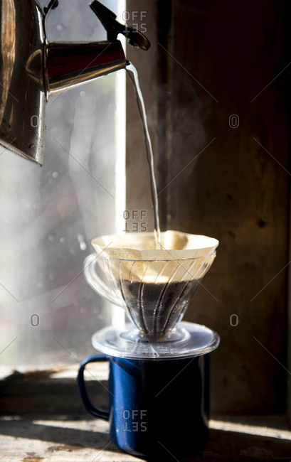 Hot water pouring into a pour over brewer