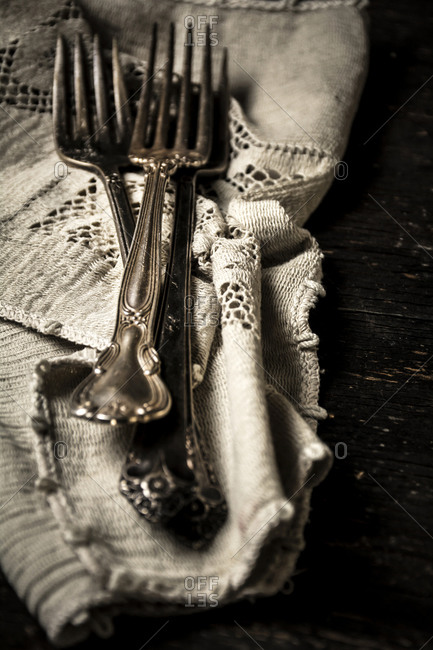 Close up of forks on a tablecloth