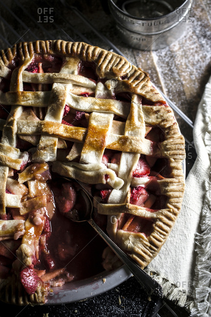 Strawberry apple pie on a wood table