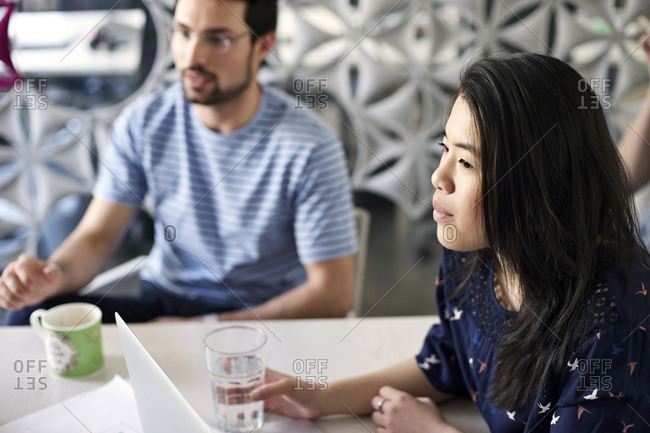 Young professionals listening during meeting