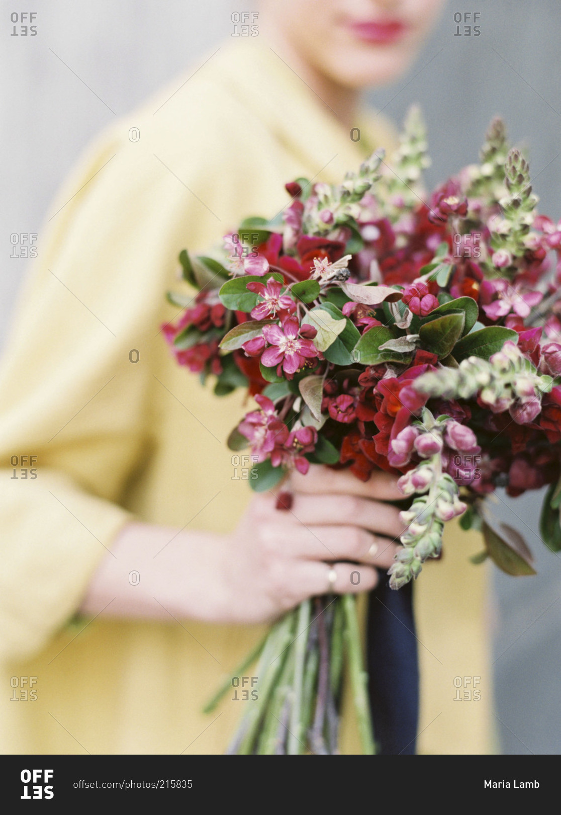 Woman holding a red flower bouquet