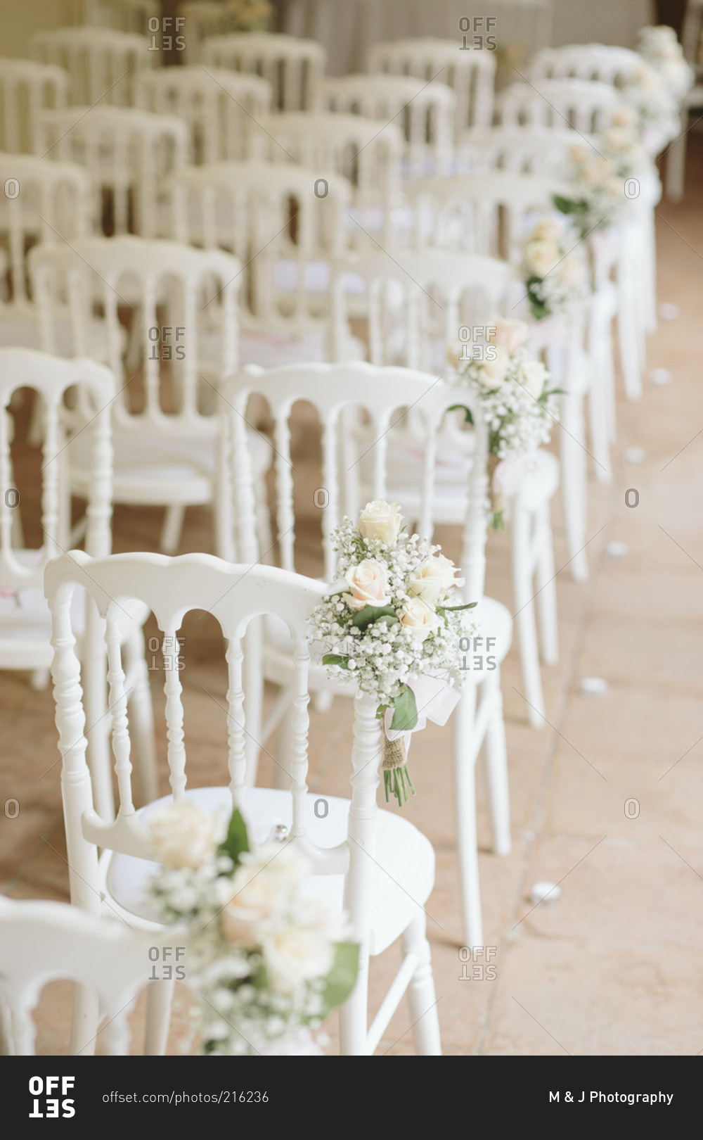 Chairs, flowers set up for wedding
