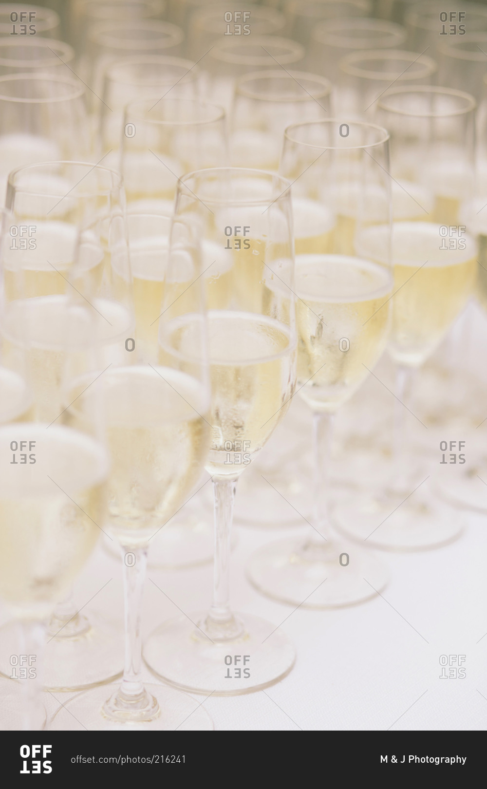 Full champagne glasses on wedding reception table