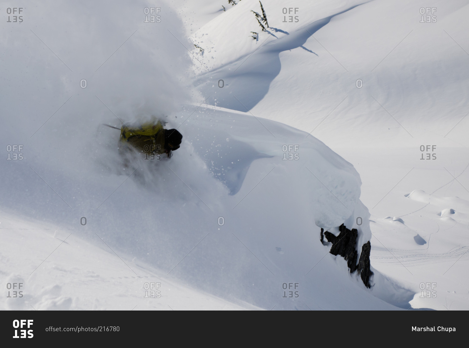 Snowboarder tearing up deep snow in Shames Mountains, BC, Canada