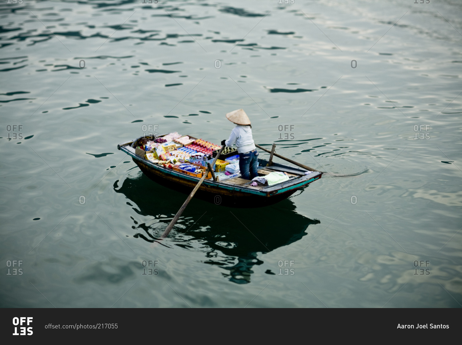 A boat travels along the waters of Halong Bay