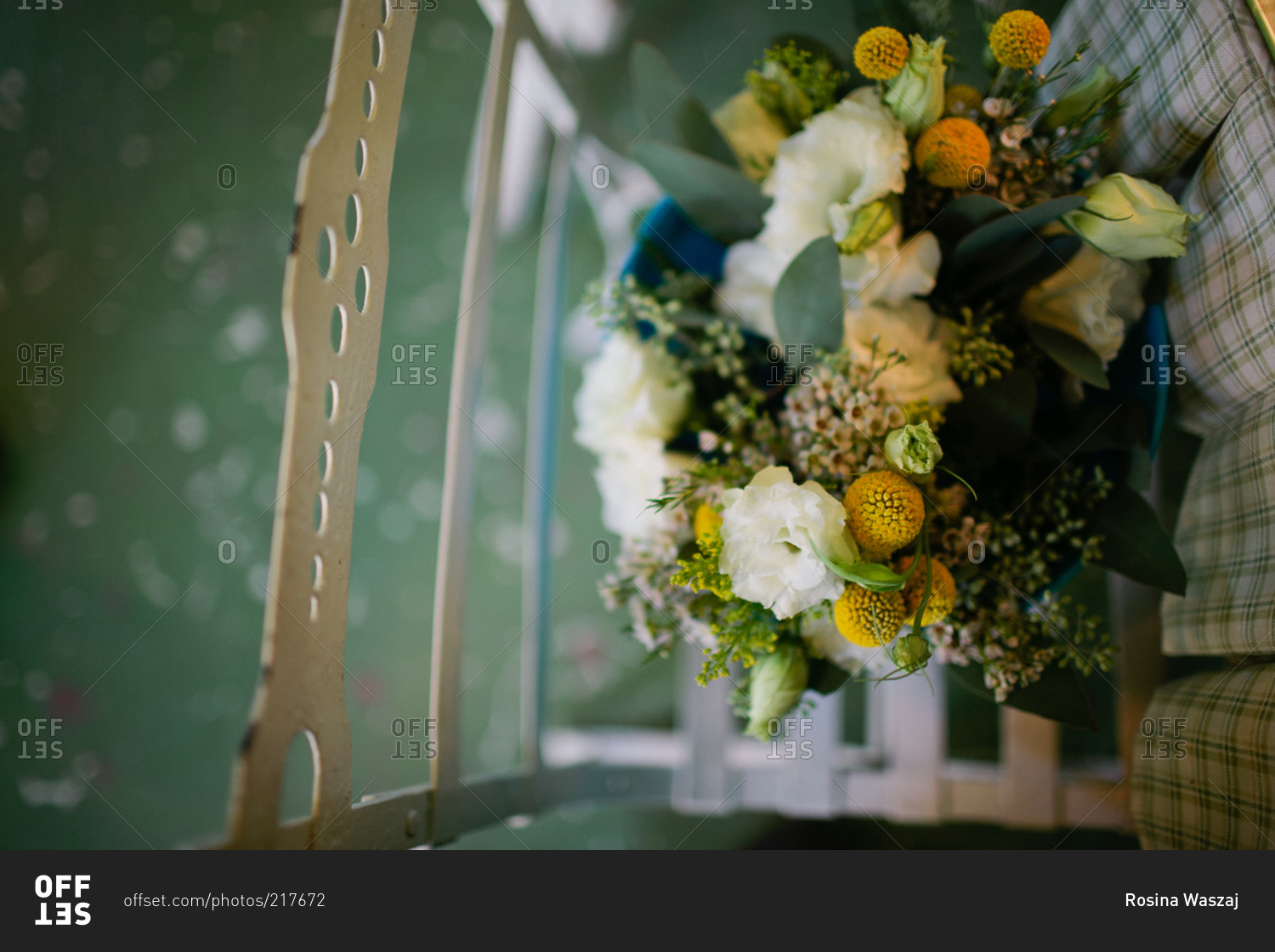 A bridal bouquet set on a chair