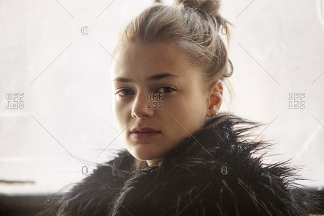 Portrait of young woman wearing a furry vest
