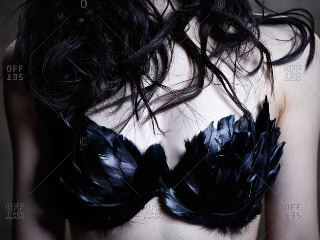 Woman in feather bra - Offset stock photo - OFFSET