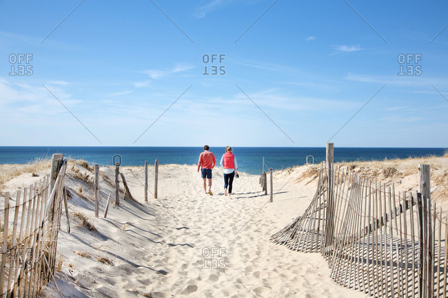 Couple walking on Cape Cod beach