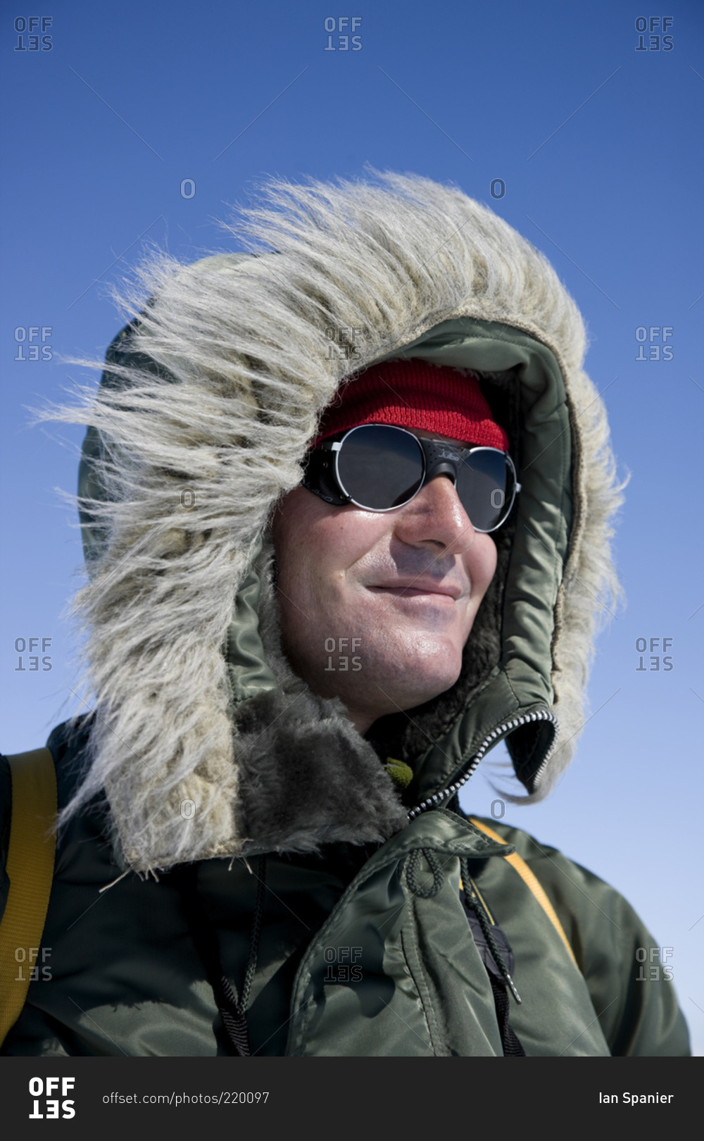 A man dressed for hiking in cold weather