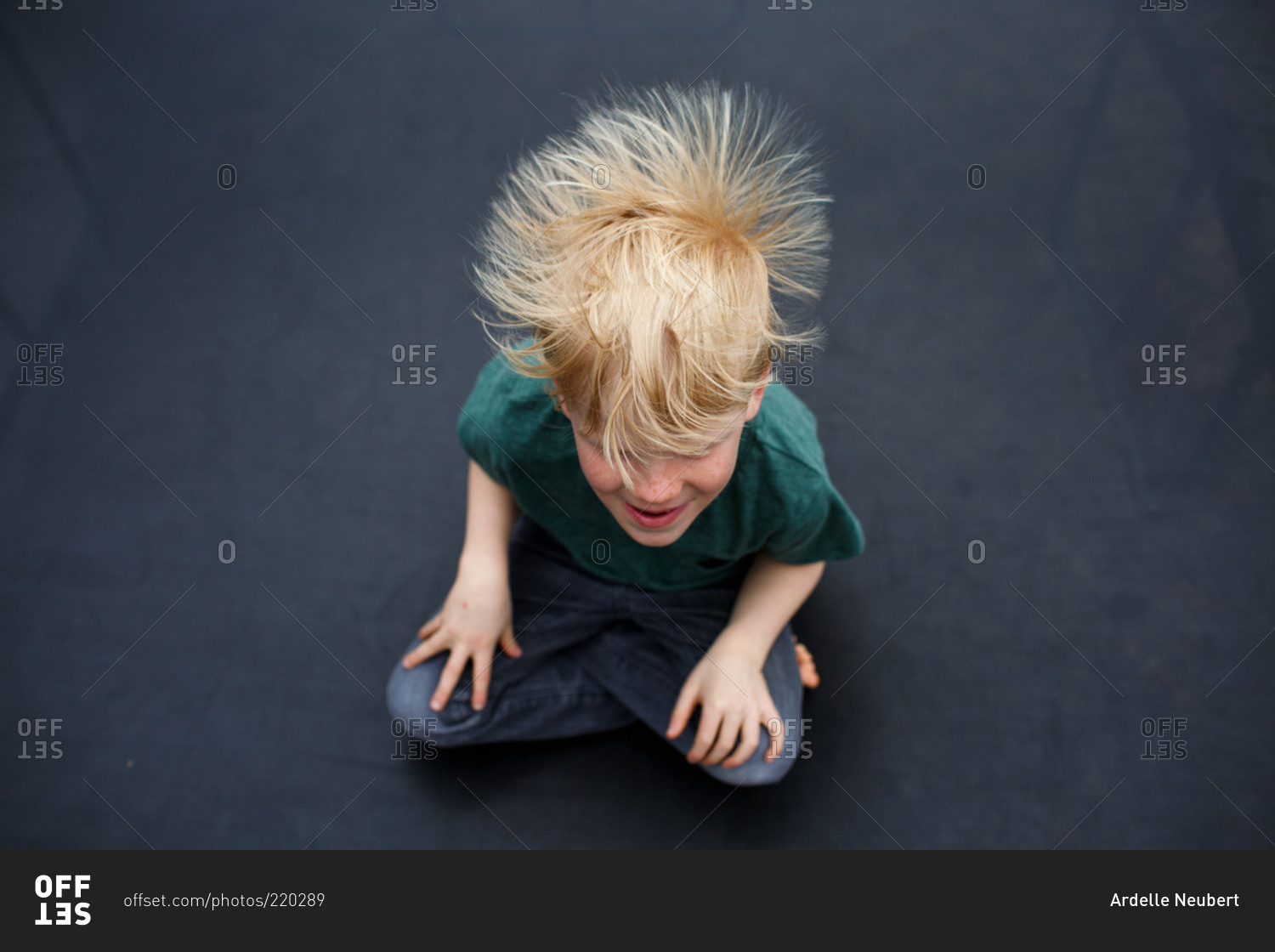 Static electricity in boy's hair from above