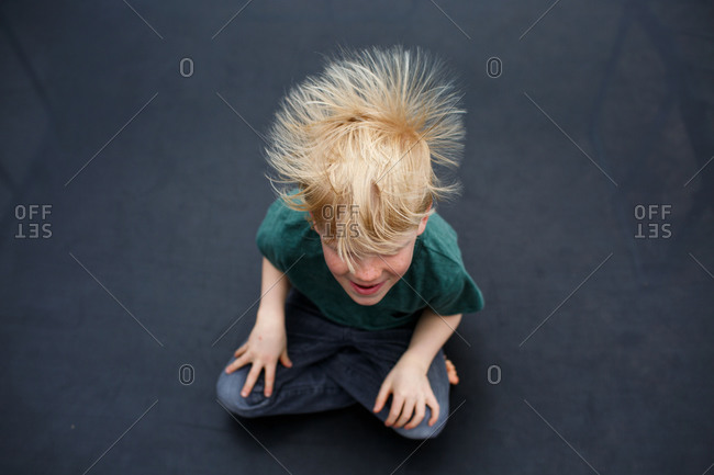 Static Electricity In Boy S Hair From Above Stock Photo Offset