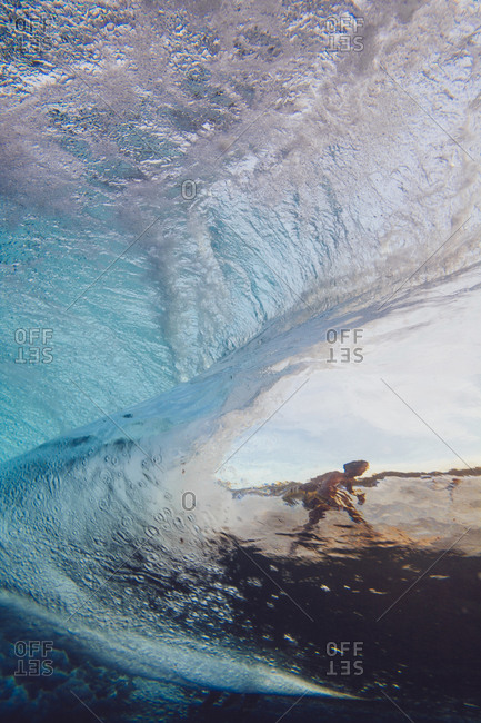A surfer from inside a wave on Siargao Island, Philippines