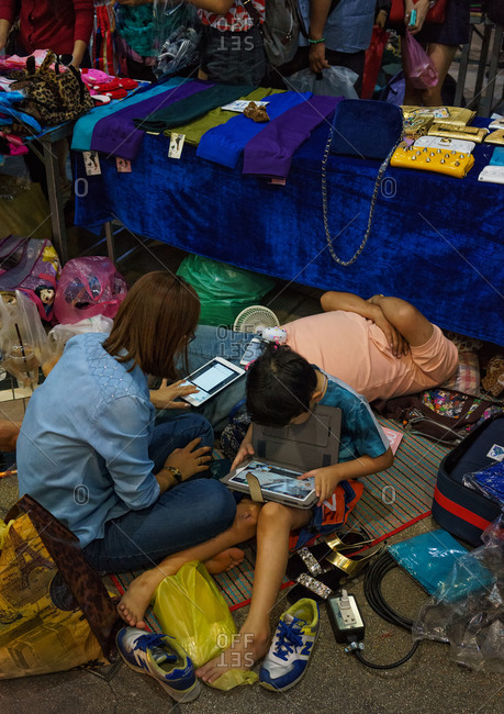 Siam Square, Bangkok, Thailand - December 16, 2014: Family peddling goods outside Siam Square