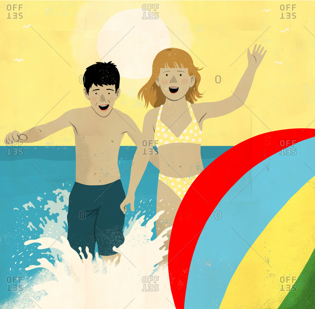 Boy and girl splash after beach ball