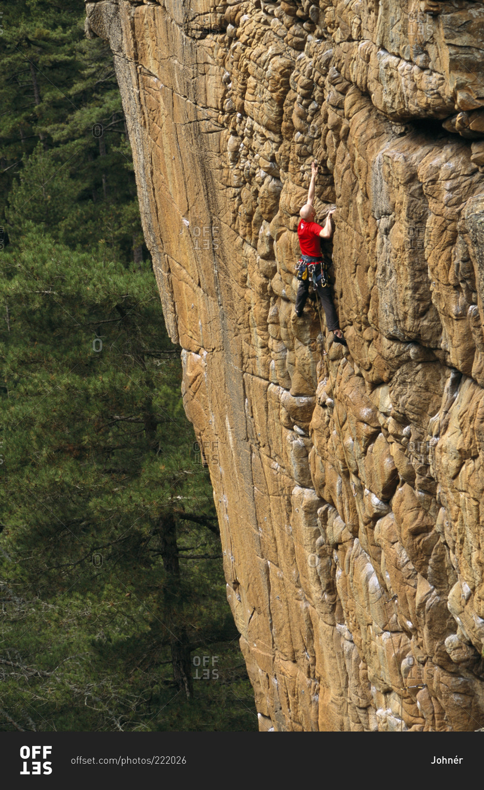 A rock climber scaling a cliff