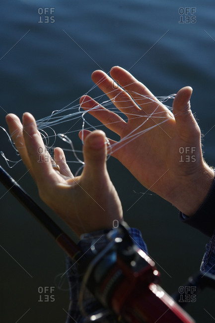 A man tangled in a fishing line stock photo - OFFSET