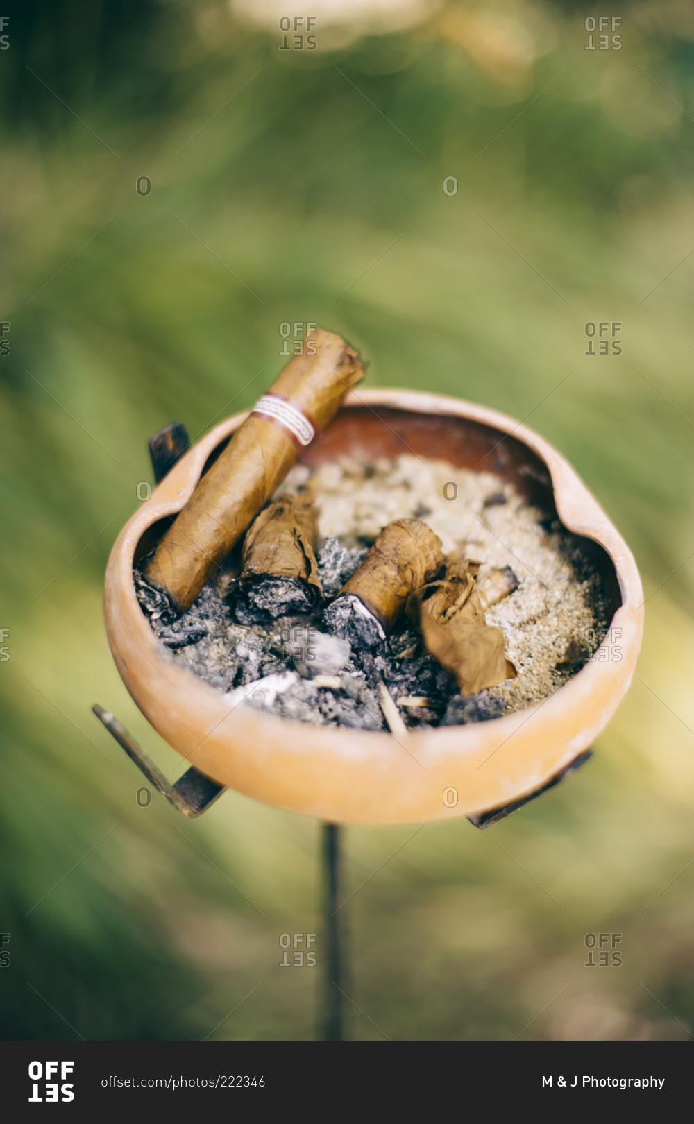 Cigar butts in an ash tray stock photo - OFFSET