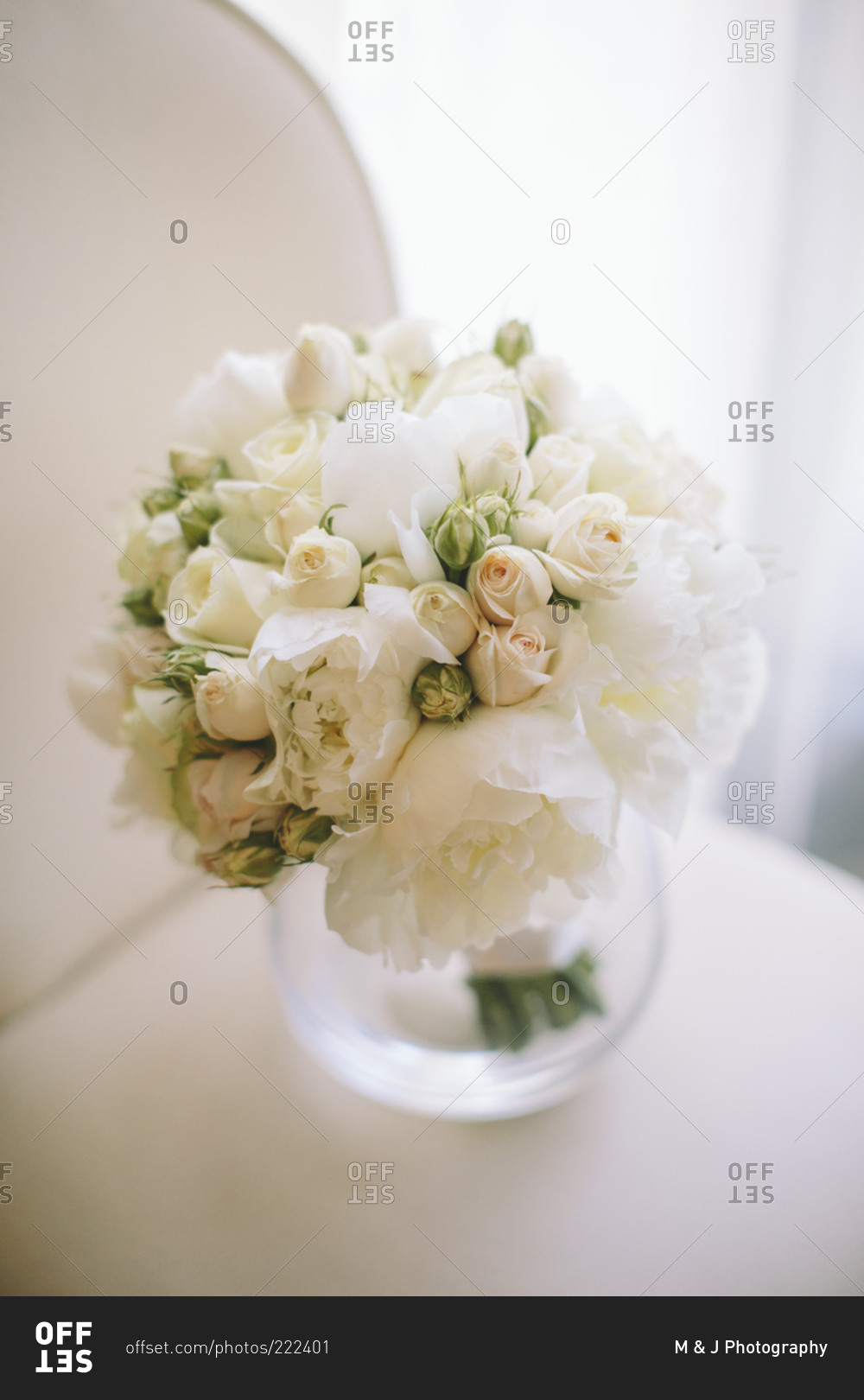 Flower bouquet of roses and peonies in a vase
