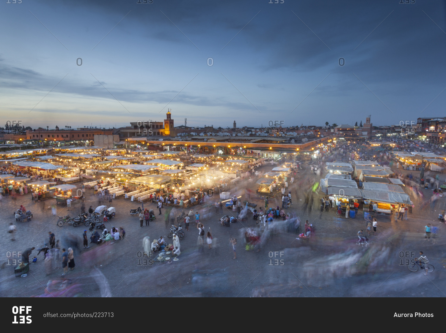 Crowds and food stalls in Jemaa al Fna square at sunset Marrakesh, Morocco