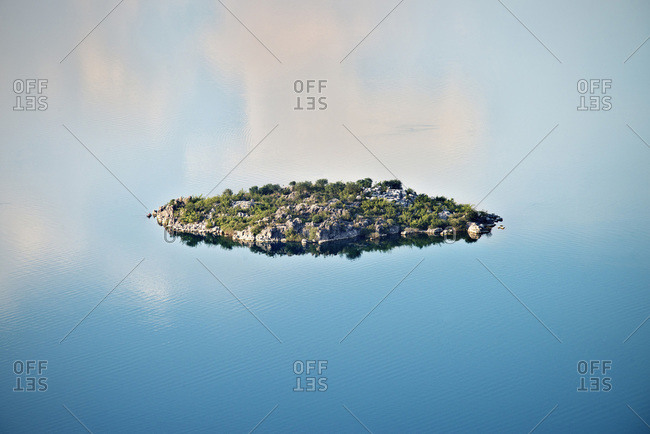 Small island in a lake around Murici, Montenegro