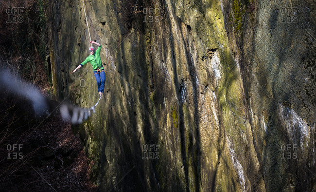 Slackliner walks along a highline