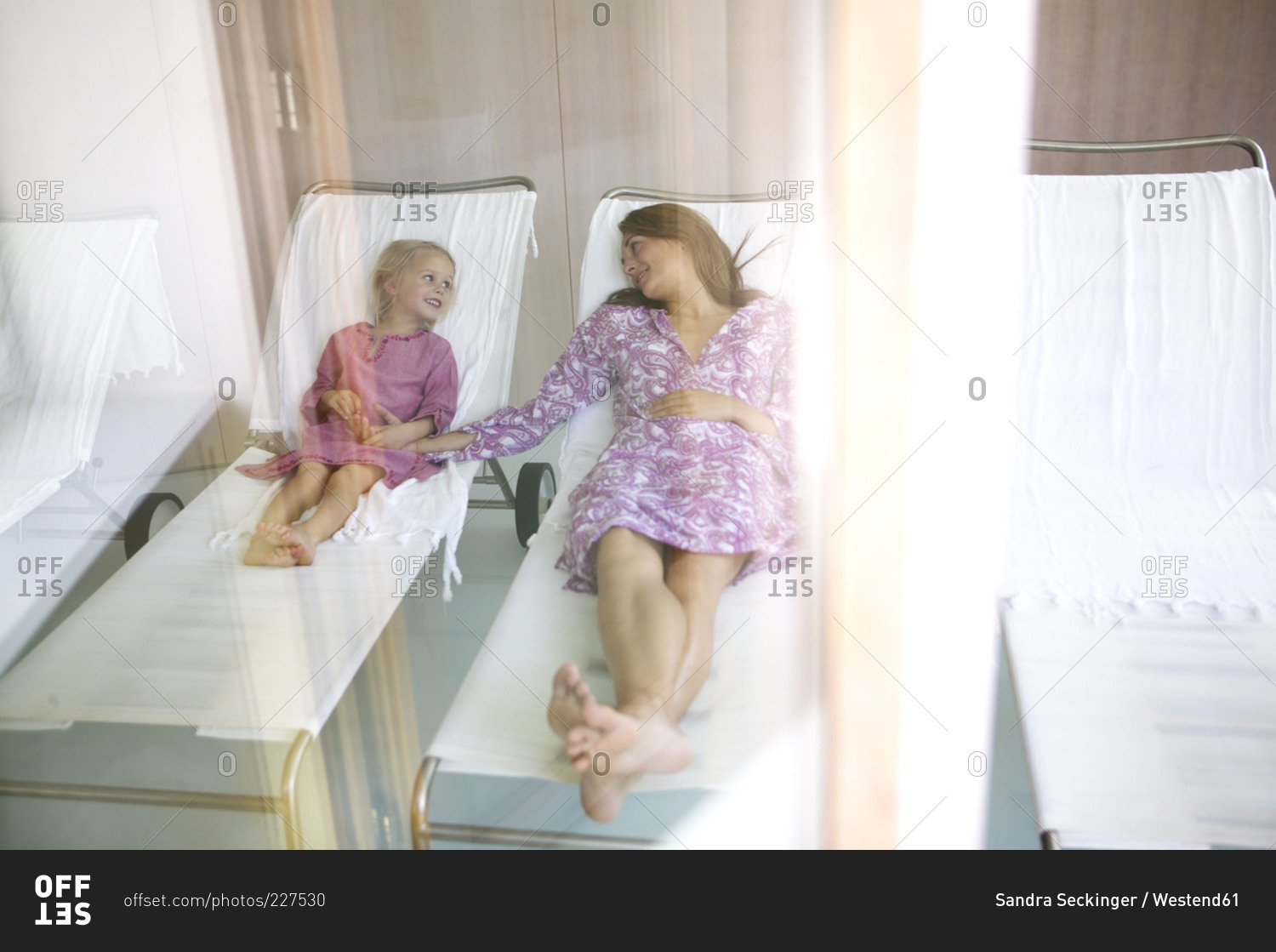 Mother and daughter relaxing in hotel spa