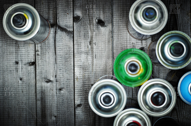 Above view of aerosol cans on wood
