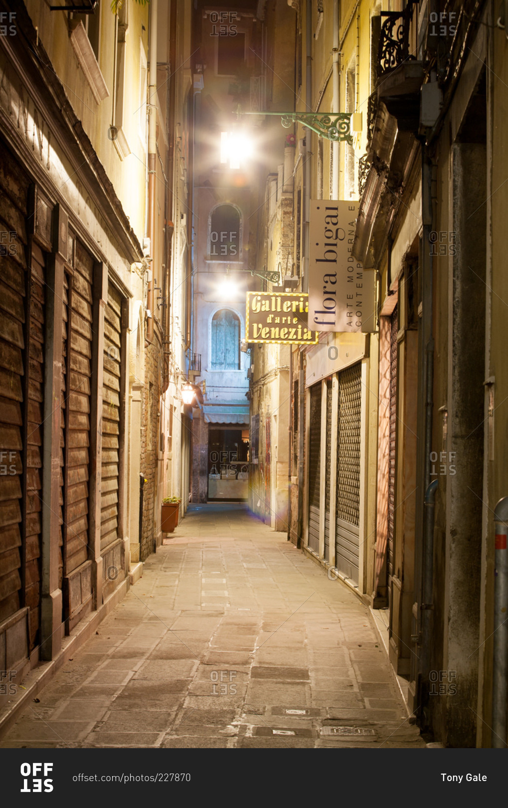 Venice, Italy - March 17, 2007: Narrow street at night in Venice, Italy