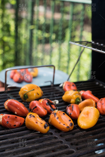 Stuffed hot peppers grilling outside