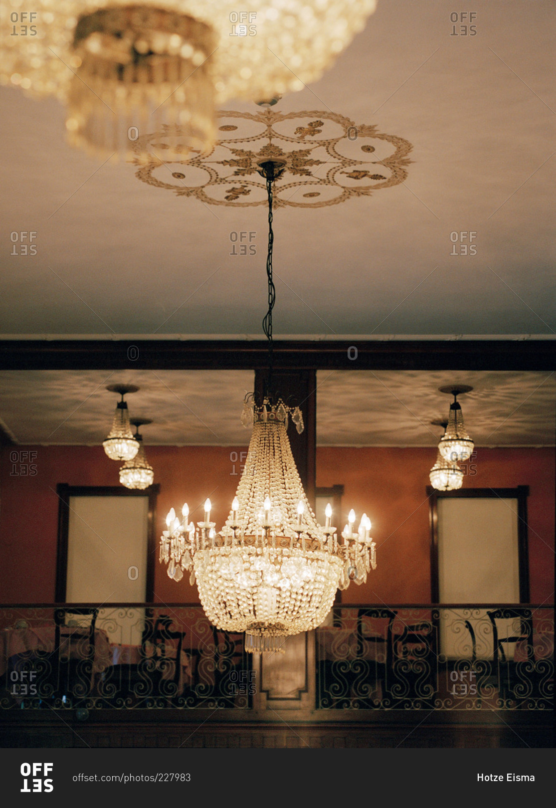 Ornate crystal chandelier and balcony in a dining room